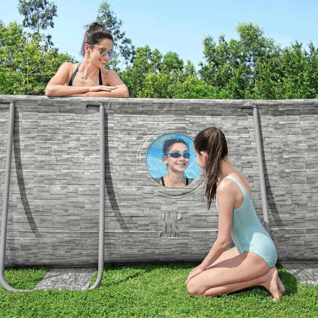 Piscine tubulaire ovale 488 x 305 x 107 cm effet pierre avec hublots et pompe – vue de côté